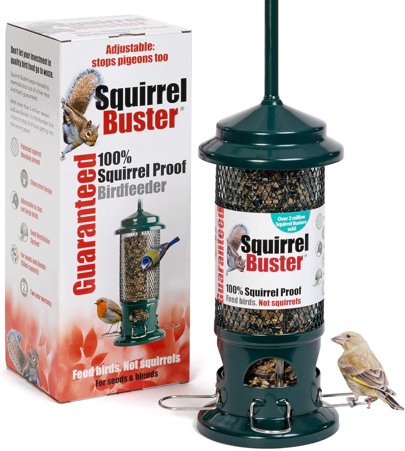 Jacobi Jayne Squirrel Buster seed feeder in green metal beside its box, with a greenfinch perched on the wire perch