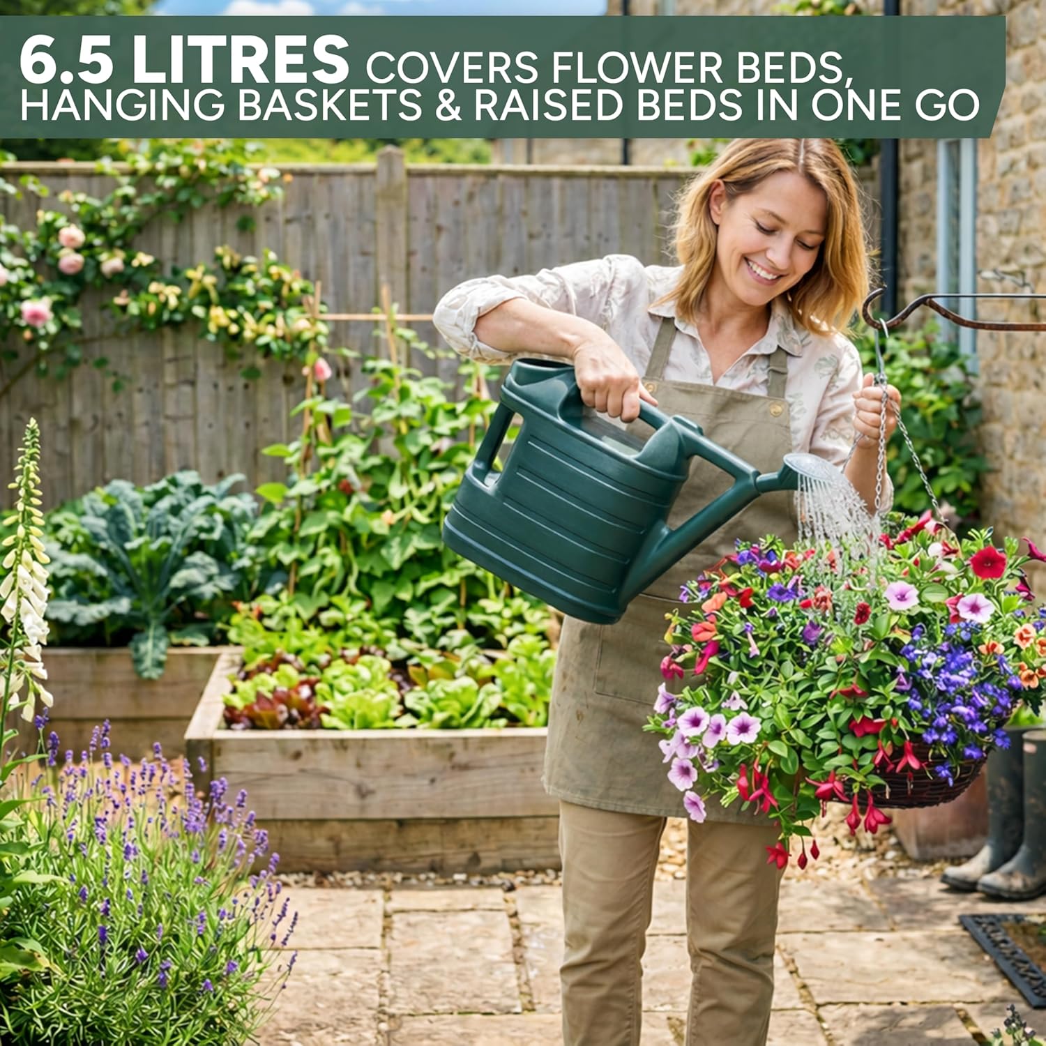 Gardener watering a hanging basket with the green Zuvo 6.5 litre watering can