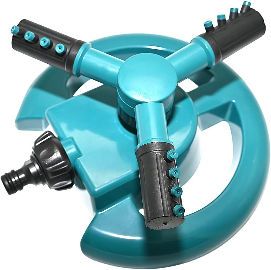 Close-up of the Ram sprinkler spinning arms throwing water across a lawn