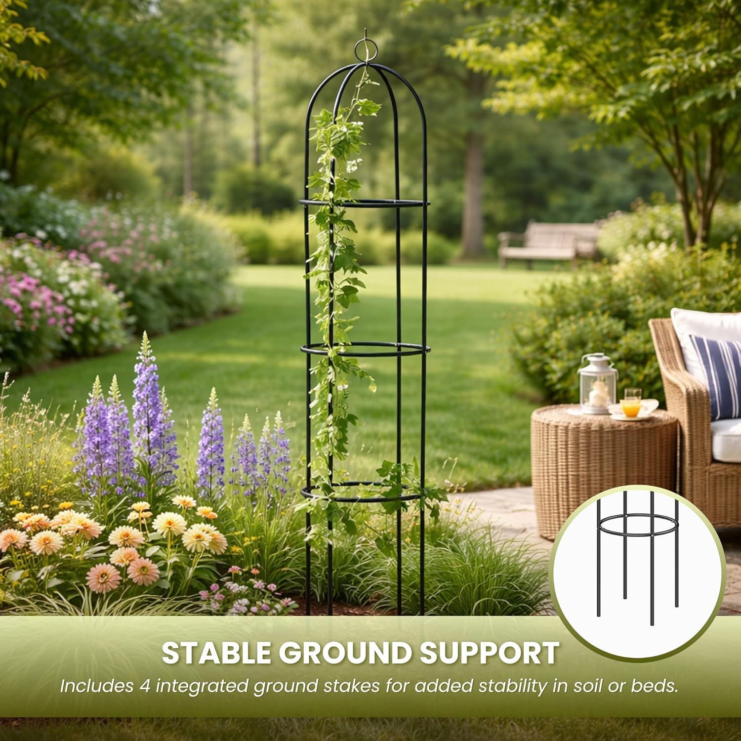 Metal obelisk staked into a flower bed showing the four ground legs that give it stability
