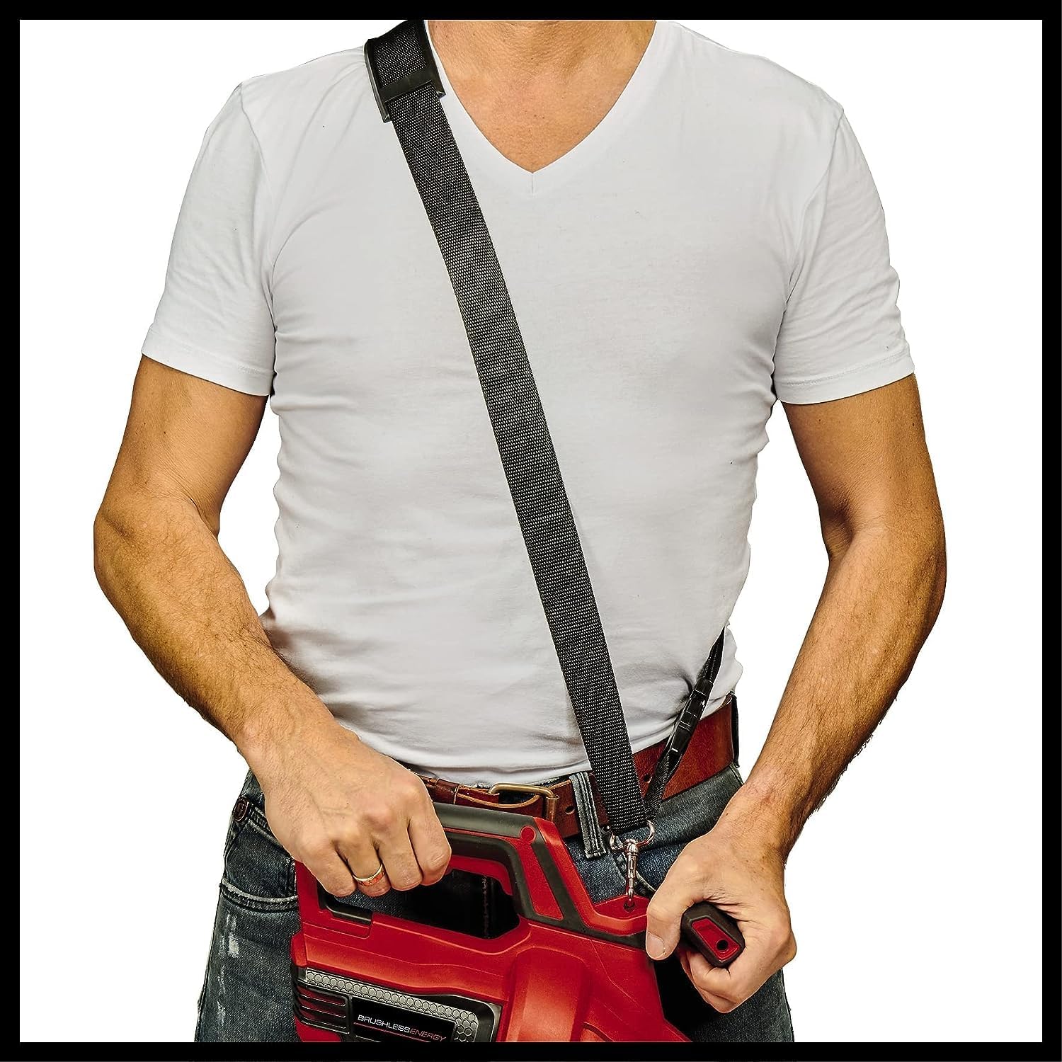 The Einhell carrying strap worn across the body, clipped to the motor unit held at waist height