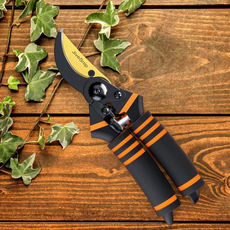 JiveSnip secateurs laying on wooden surface with ivy leaves showing garden tool aesthetic